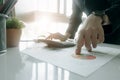 Accountants work analyzing financial reports on a laptop at his office, business analytics concept