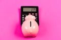 Accounting business. Piggy bank symbol money savings. Investments concept. Piggy bank pig and calculator. Taxes and Royalty Free Stock Photo