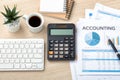 Accounting concept with calculator, accounting paper and computer keyboard Royalty Free Stock Photo