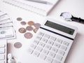 Accounting concept with keyboard, smartphone, notebook, coffee cup, calculator and money on white table background. Royalty Free Stock Photo