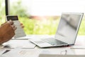 At the accounting desk, an accountant presses a calculator to analyze investment charts to generate monthly financial reports or c Royalty Free Stock Photo