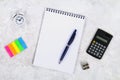 Accounting, financial concept, flat lay or top view of black pen, calculator with white notepad on table with blank copy space, ma Royalty Free Stock Photo