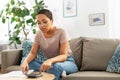 African woman with papers and calculator at home Royalty Free Stock Photo