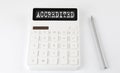 ACCREDITED business text on calculator with pencil Royalty Free Stock Photo