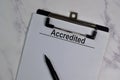 Accredited write on a paperwork isolated on office desk