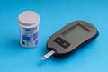 Accu Chek Performa Digital Blood Glucose Meter closeup for Diabetes on blue background