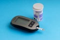 Accu Chek Performa Digital Blood Glucose Meter closeup for Diabetes on blue background