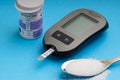 Accu Chek Performa Digital Blood Glucose Meter closeup for Diabetes on blue background