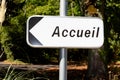 Accueil in french text panel means welcome entry reception with arrow road sign