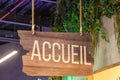 accueil in french text panel means welcome entry sign on wooden plank