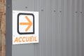 Accueil text sign french on entrance means welcome reception place with orange arrow