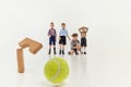 Accuracy. Group of kids, boys, children in classical retro clothes playing together over grey studio background. Concept Royalty Free Stock Photo