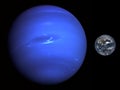 Accurate size comparison of Earth and Neptune. Planets of Solar System. Royalty Free Stock Photo