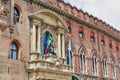 Accursio Palace with statue of Pope Gregory in Bologna, Italy