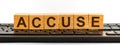 ACCUSE word made with building blocks jn the black keyboard