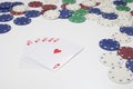 Ace card on pile surrounded by poker chips Royalty Free Stock Photo