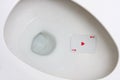 Ace Card in Toilet Hole Royalty Free Stock Photo