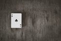 Ace of clubs. playing cards on a wooden background. Risk and Gambling background, abstract and game concept.