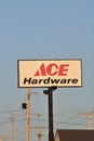 Ace Hardware advertisement sign that`s bright and colorful with blue sky on a metal pole in Kansas.