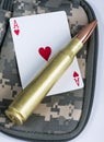 Ace of hearts and bullets. Royalty Free Stock Photo