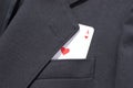 Ace of hearts playing card in business man suit pocket Royalty Free Stock Photo