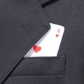 Ace of hearts playing card in business man suit pocket Royalty Free Stock Photo