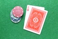 Ace of hearts poker cards with chips on gaming table