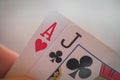 Ace and jack, Playing cards in hand on the table, poker nands Royalty Free Stock Photo