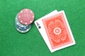 Ace of clubs poker cards with chips on gaming table