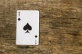 Ace of spades on old wooden background Royalty Free Stock Photo