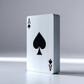 Ace of Spades playing card with black spade symbol and stack of cards on white surface Royalty Free Stock Photo