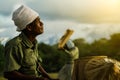 Old man kneels, looking up at the sky and prays