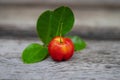 Acerola cherry fruit close up on wood background Royalty Free Stock Photo