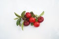 Acerola Cherry with half slice and green leaves isolated on white background Royalty Free Stock Photo