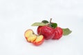 Acerola Cherry with half slice and green leaves isolated on white background Royalty Free Stock Photo