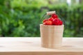 Acerola cherry in wooden bucket on wooden background. Select  focus, Barbados cherry, Malpighia emarginata, high vitamin . Acerola Royalty Free Stock Photo