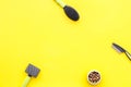 Acessories for the grooming of the dog. Combs and brushes for dogs. Yellow background top view mock-up