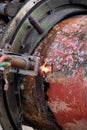 Acetylene torch and iron pipe