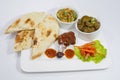 Achary Beef Curry, BBQ Chicken, Indian Style mix vegetable, plain nan and Green Salad Platter.