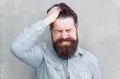 Aches and pains. headache and overworking. negative emotions. feel bad. Bearded man. Mature hipster with beard. male Royalty Free Stock Photo