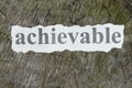 Achievable word written on a newspaper cut out