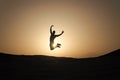 Achieve main goal. Silhouette man motion jump in front of sunset sky background. Future success depends on your efforts Royalty Free Stock Photo