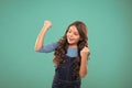 Achieve success. Kid cheerful celebrate victory. Girl cute child long curly hair happy smiling. Child psychology and Royalty Free Stock Photo