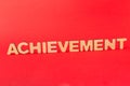 Achievement inscription on red background