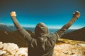 Achievement and triumph. Victorious female person on mountain to Royalty Free Stock Photo