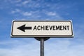 Achievement white road sign with arrow, arrow on blue sky background