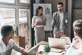 Achieving best results. Two young colleagues conducting a business presentation while working in the creative office Royalty Free Stock Photo