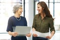 Achieving excellence together. two colleagues working together in an office. Royalty Free Stock Photo