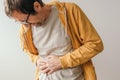 Aching appendix, adult male with painful appendicitis symptoms, man pressing lower right abdomen Royalty Free Stock Photo