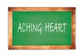 ACHING HEART text written on green school board
